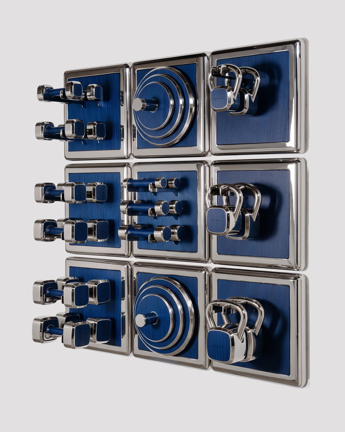 ALAMA twelve-module wall configuration example in ALPI Wavy Fir Blue and mirror-polished steel, with illustrative equipment. Standard offer: nine modules.