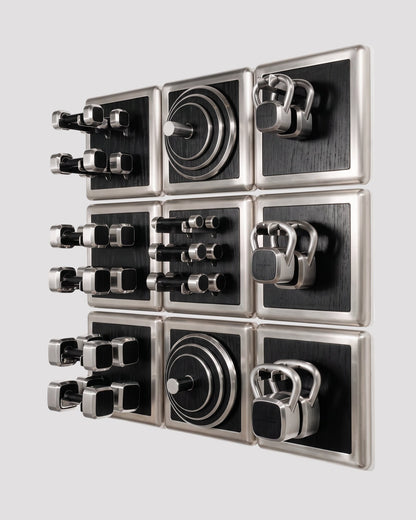 ALAMA twelve-module wall configuration example in ALPI Planked Black and satin steel, with illustrative equipment. Standard offer: nine modules.