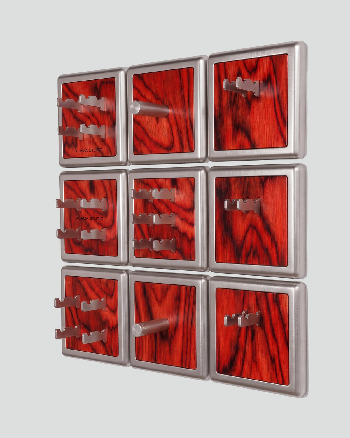 ALAMA twelve-module wall configuration example in ALPI Sottsass Red and satin steel, storage-only view. Standard offer: nine modules.