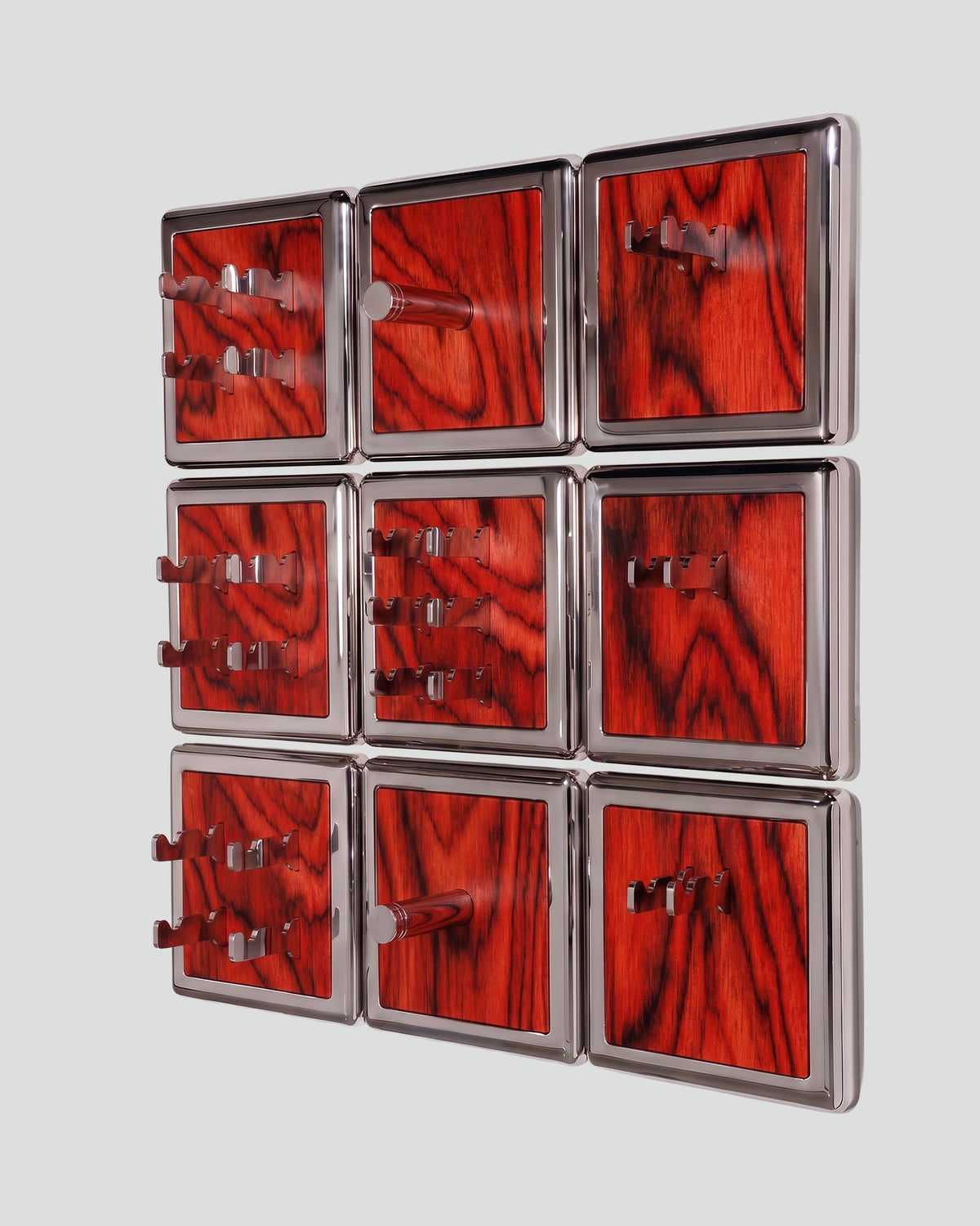 ALAMA twelve-module wall configuration example in ALPI Sottsass Red and mirror-polished steel, storage-only view. Standard offer: nine modules.