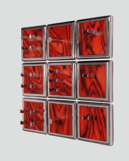 ALAMA twelve-module wall configuration example in ALPI Sottsass Red and mirror-polished steel, storage-only view. Standard offer: nine modules.