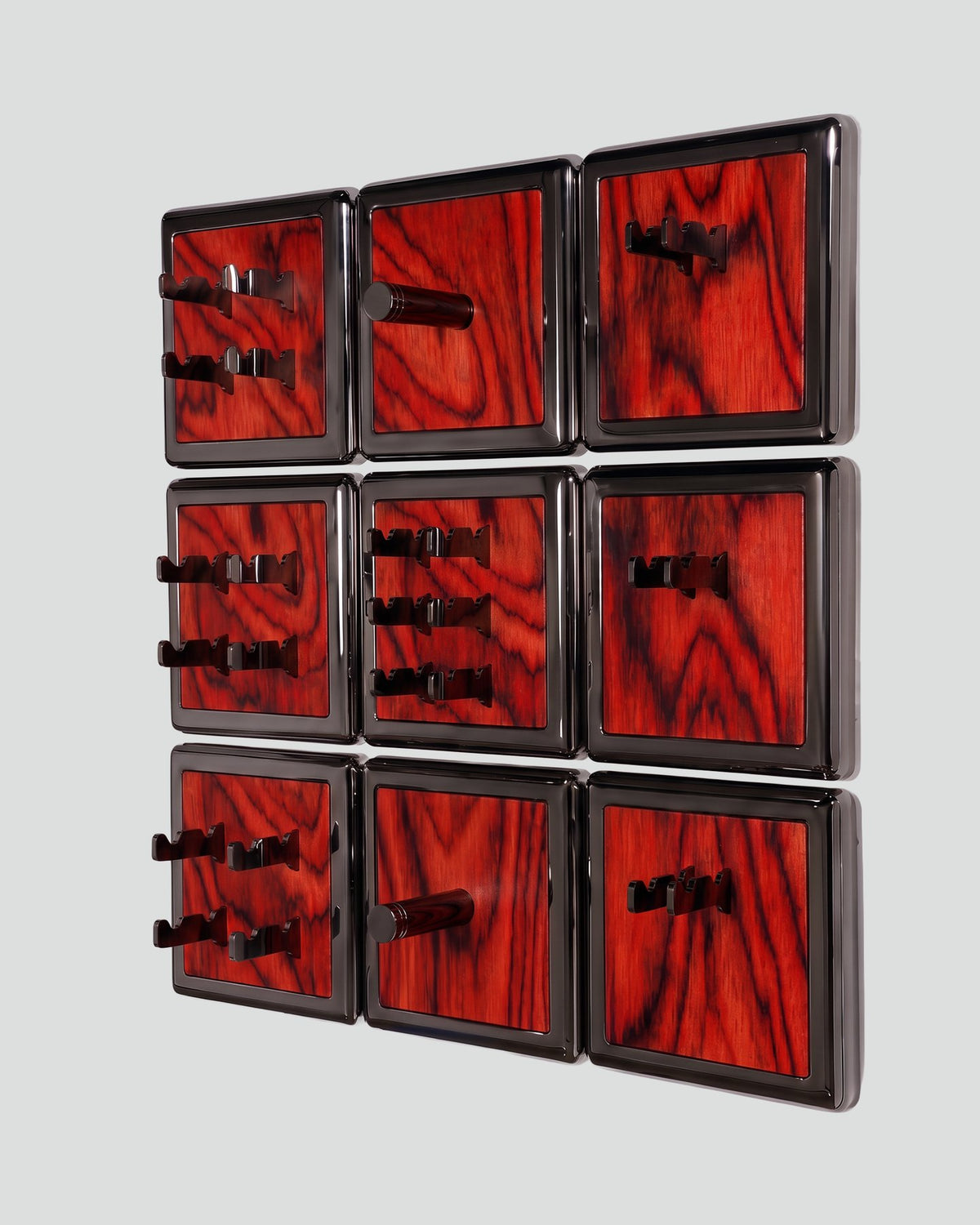 ALAMA twelve-module wall configuration example in ALPI Sottsass Red and black metal, storage-only view. Standard offer: nine modules.