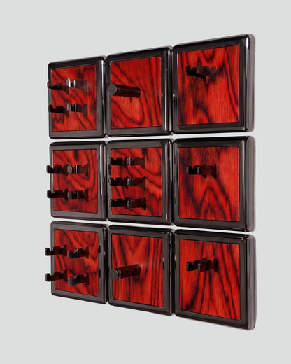 ALAMA twelve-module wall configuration example in ALPI Sottsass Red and black metal, storage-only view. Standard offer: nine modules.
