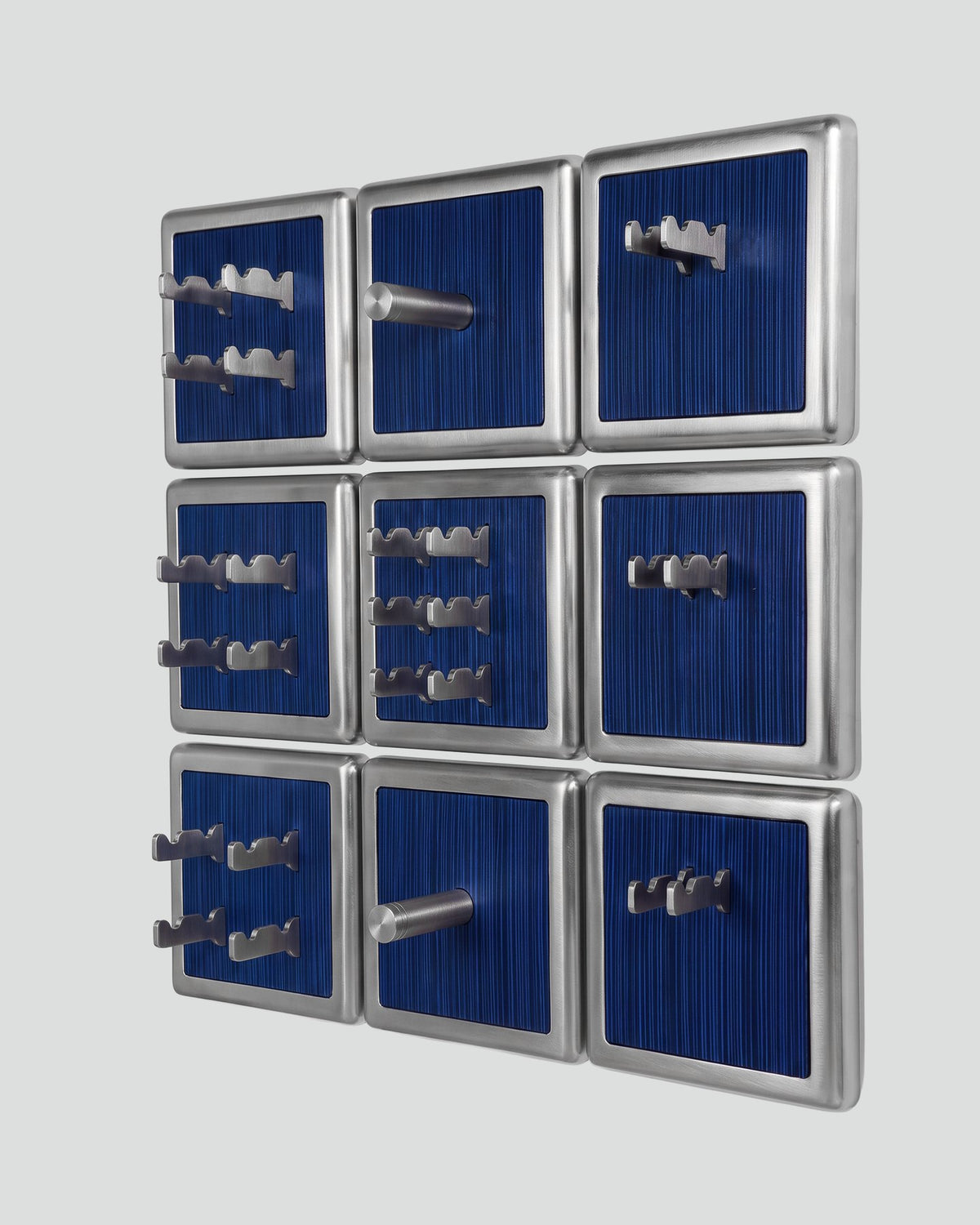 ALAMA twelve-module wall configuration example in ALPI Wavy Fir Blue and satin steel, storage-only view. Standard offer: nine modules.
