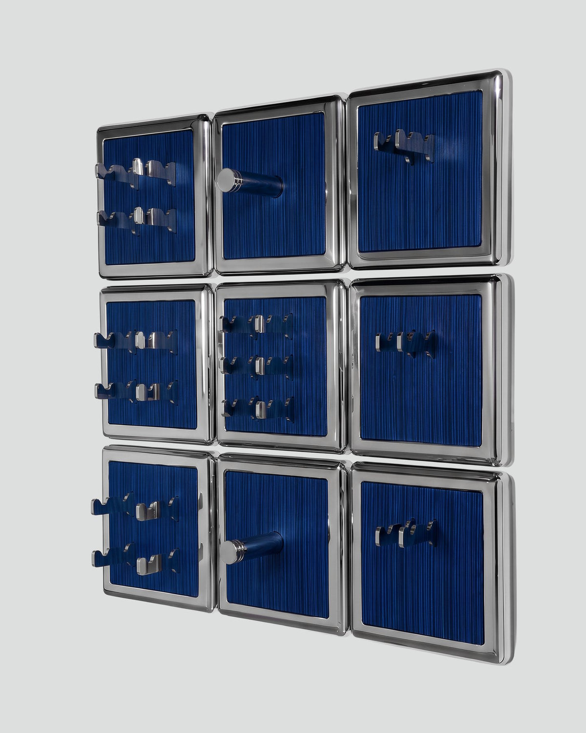 ALAMA twelve-module wall configuration example in ALPI Wavy Fir Blue and mirror-polished steel, storage-only view. Standard offer: nine modules.