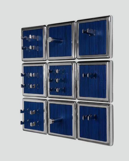 ALAMA twelve-module wall configuration example in ALPI Wavy Fir Blue and mirror-polished steel, storage-only view. Standard offer: nine modules.