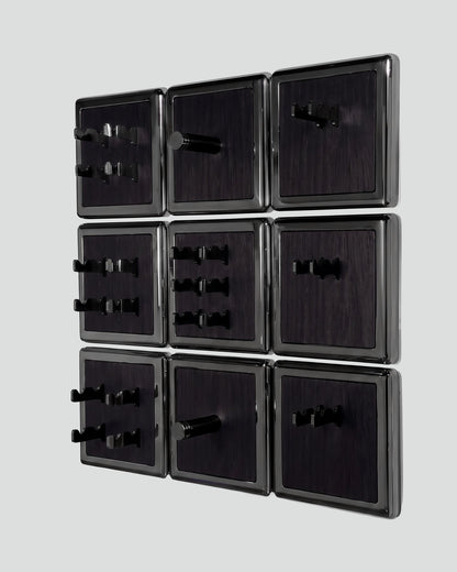 ALAMA twelve-module wall configuration example in ALPI Planked Black and black metal, storage-only view. Standard offer: nine modules.