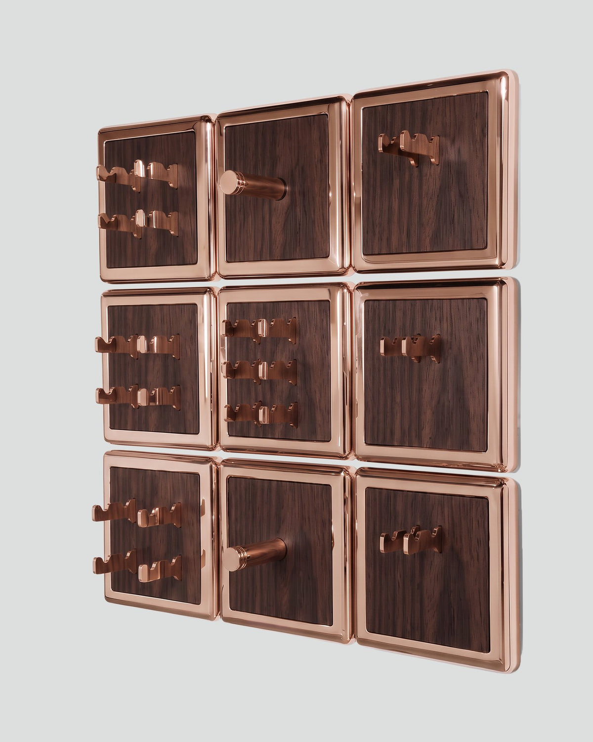 ALAMA twelve-module wall configuration example in ALPI Flamed Kakao and rose gold metal, storage-only view. Standard offer: nine modules.