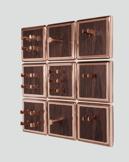 ALAMA twelve-module wall configuration example in ALPI Flamed Kakao and rose gold metal, storage-only view. Standard offer: nine modules.
