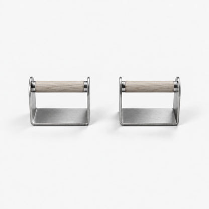 Dann Pushup Bars — front view; Grey Ash wood grips and natural stainless steel. FYSIK studio finish study — October 2026. Representative configuration.