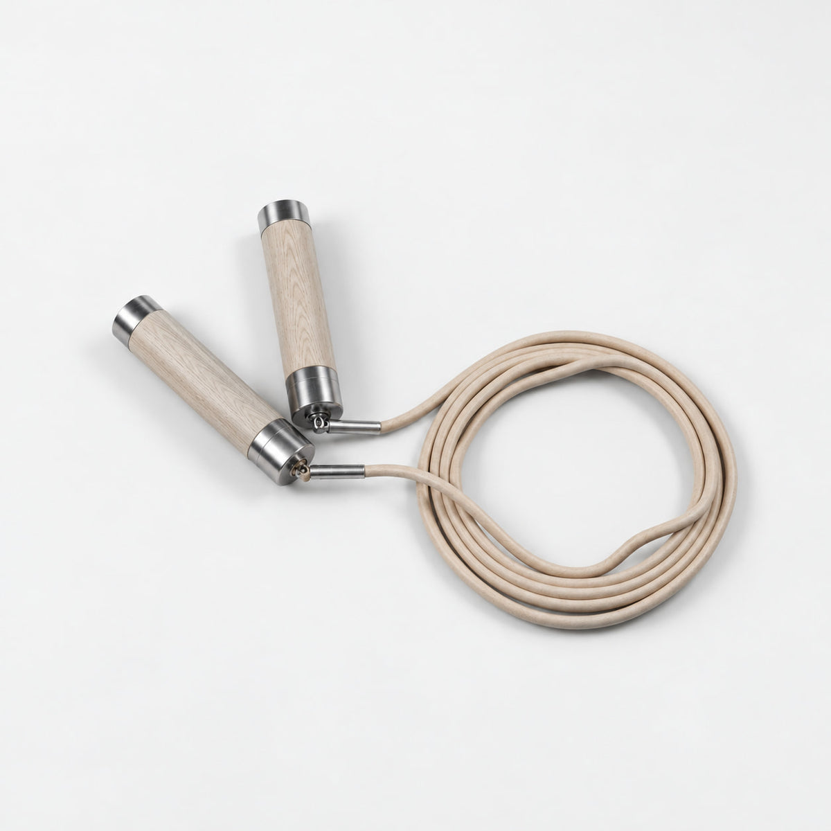 Dod Jump Rope — angled view; Grey Ash wood, beige leather and natural stainless steel where applicable. FYSIK studio finish study — October 2026. Representative configuration.