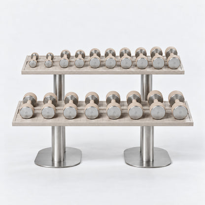 Fysik Horizontal 2 Tier Dumbbell Rack — front view; Grey Ash wood, beige leather and natural stainless steel where applicable. FYSIK studio finish study — October 2026. Representative configuration.