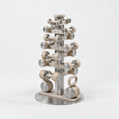 Fysik Vertical Combo Tower — angled view; Grey Ash wood, beige leather and natural stainless steel where applicable. FYSIK studio finish study — October 2026. Representative configuration.
