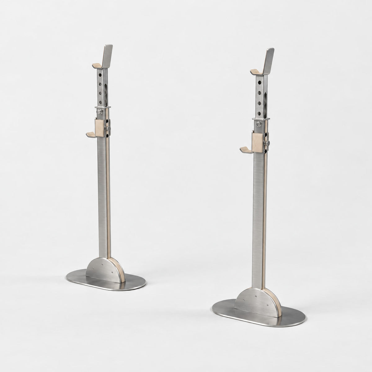 Khun Barbell Rack — angled view; Grey Ash wood, beige leather and natural stainless steel where applicable. FYSIK studio finish study — October 2026. Representative configuration.