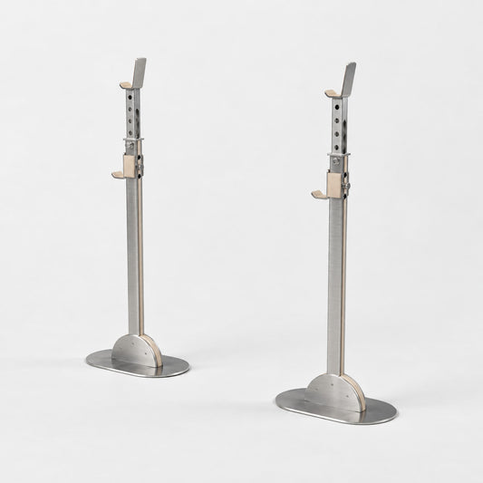 Khun Barbell Rack — angled view; Grey Ash wood, beige leather and natural stainless steel where applicable. FYSIK studio finish study — October 2026. Representative configuration.