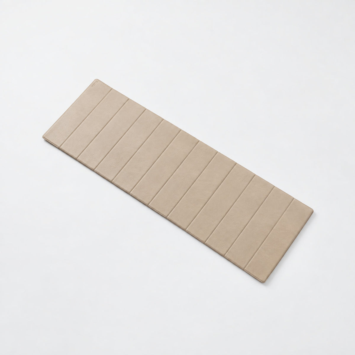Phap Exercise Mat — angled view; Grey Ash wood, beige leather and natural stainless steel where applicable. FYSIK studio finish study — October 2026. Representative configuration.