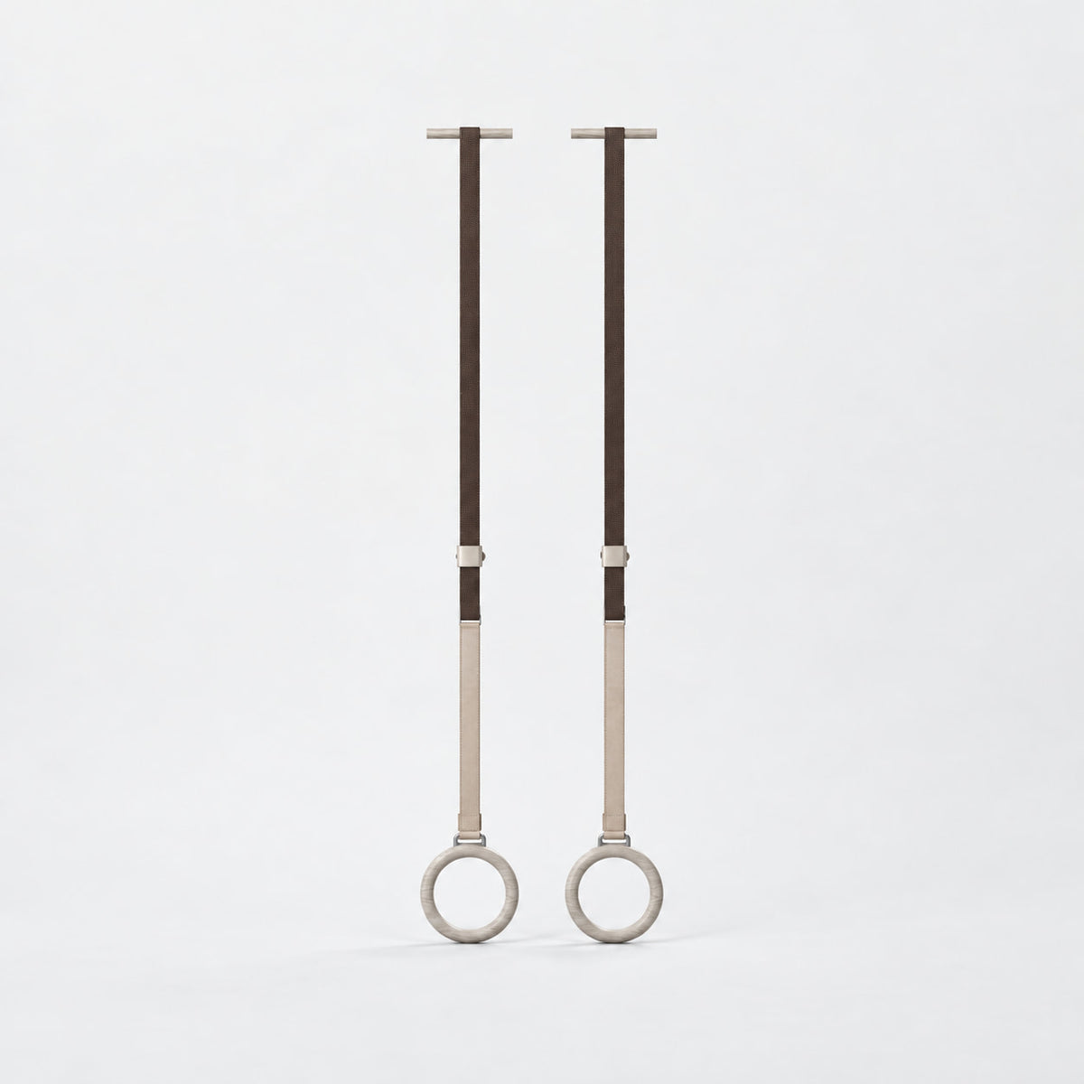 Waen Gymnastics Rings — front view; Grey Ash wood, beige leather and natural stainless steel where applicable. FYSIK studio finish study — October 2026. Representative configuration.