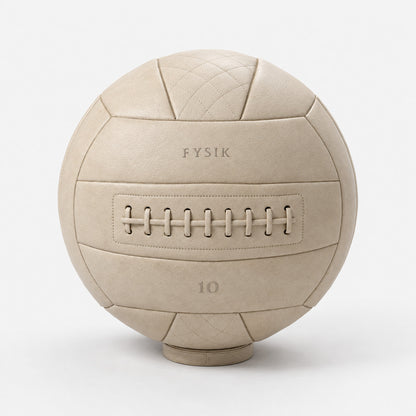 Yai Medicine Ball — front view; Grey Ash wood, beige leather and natural stainless steel where applicable. FYSIK studio finish study — October 2026. Representative configuration.
