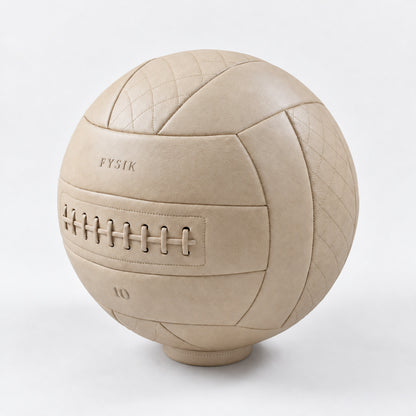 Yai Medicine Ball — angled view; Grey Ash wood, beige leather and natural stainless steel where applicable. FYSIK studio finish study — October 2026. Representative configuration.