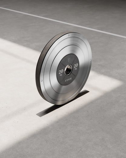 KLOM weight plate detail; one matching pair sold at the selected weight. Tower and barbell excluded.