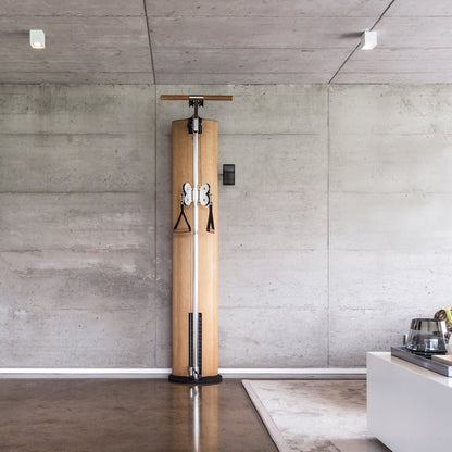NOHRD SlimBeam cable trainer in a concrete-walled interior